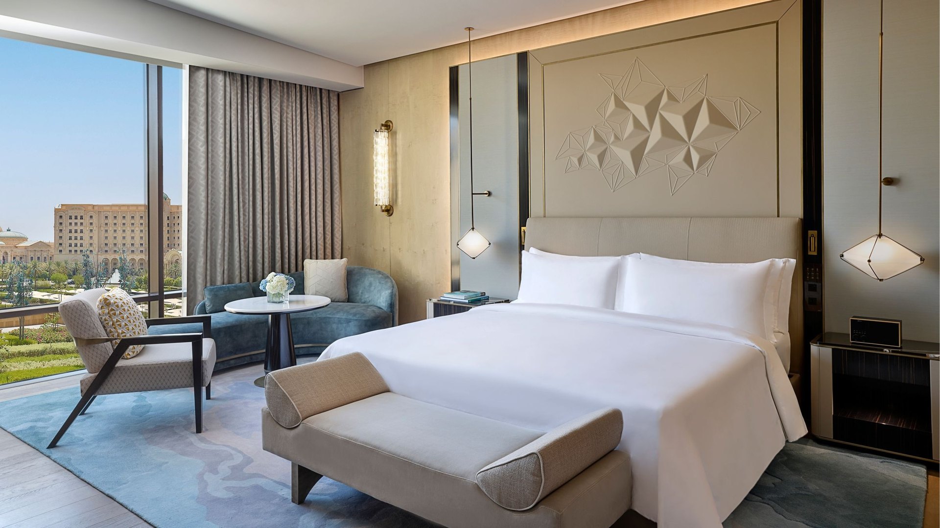 A Deluxe room at The St. Regis Riyadh, its wide window looking over gardens