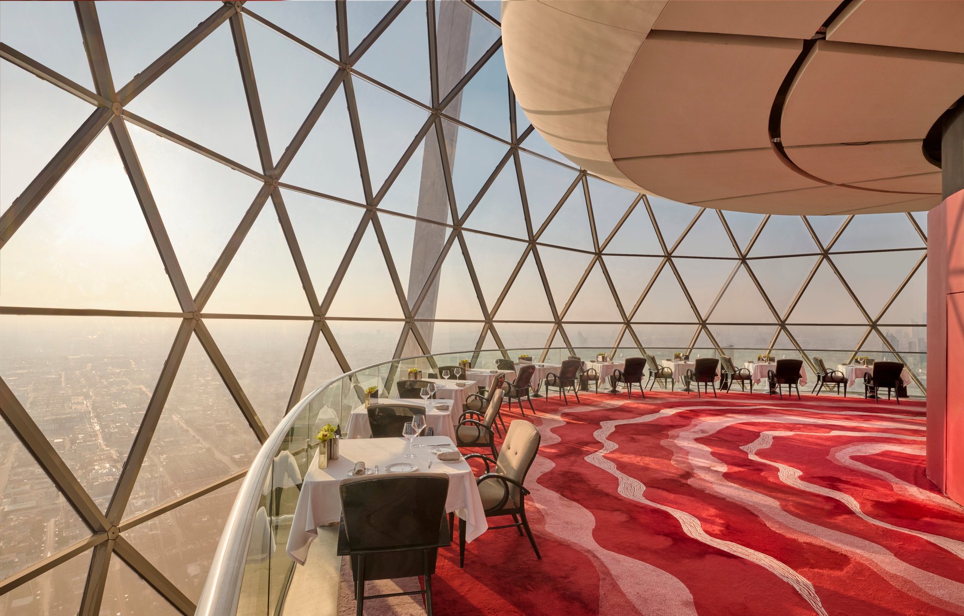 The Globe by day, its red carpet curving inside the glass sphere high above Riyadh