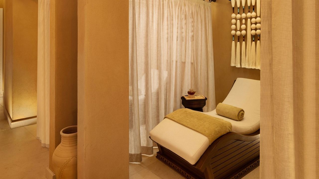 A relaxation alcove at Sidr Spa, Bab Samhan, behind linen curtains