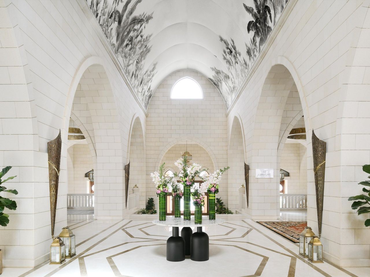 The vaulted white-stone lobby of InterContinental Durrat Al Riyadh Resort & Spa, its ceiling painted with palms