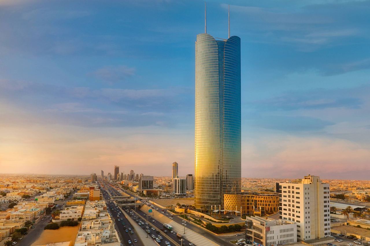 The tower of JW Marriott Hotel Riyadh catching the evening sun above King Fahad Road