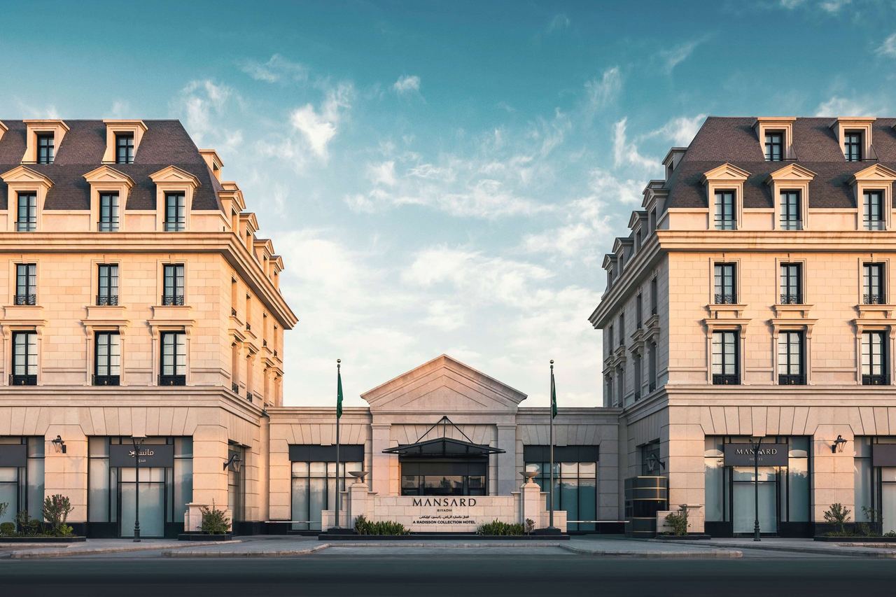 Mansard Riyadh, its two Parisian-style wings with slate mansard roofs either side of the entrance