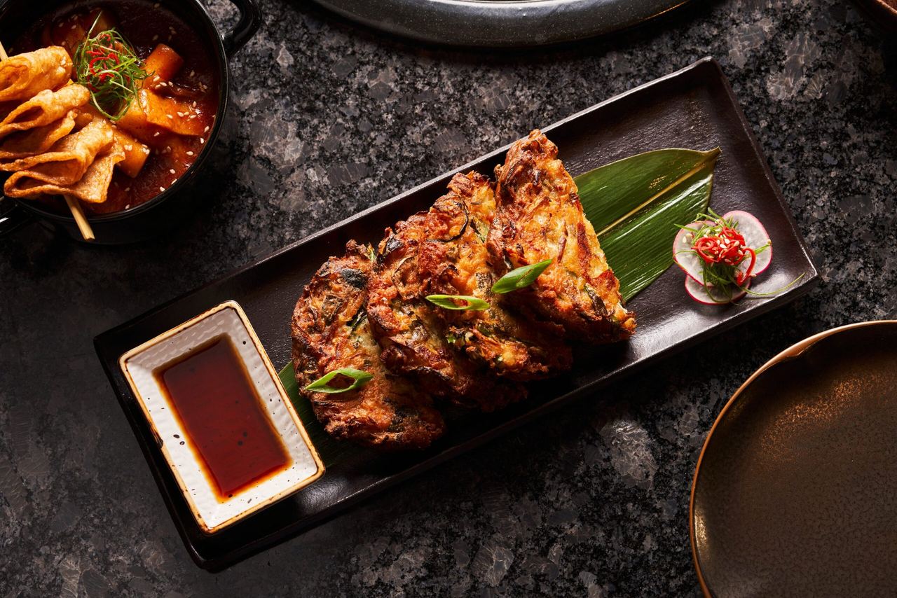 Korean pancakes with dipping sauce and fish-cake skewers at Namu